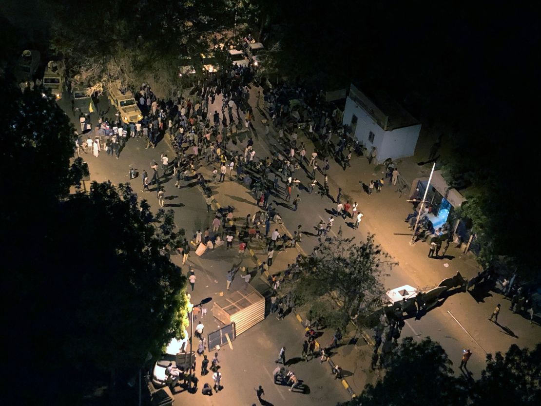 Sudanese protesters gather near a sit-in following clashes between the protesters and authorities Monday.