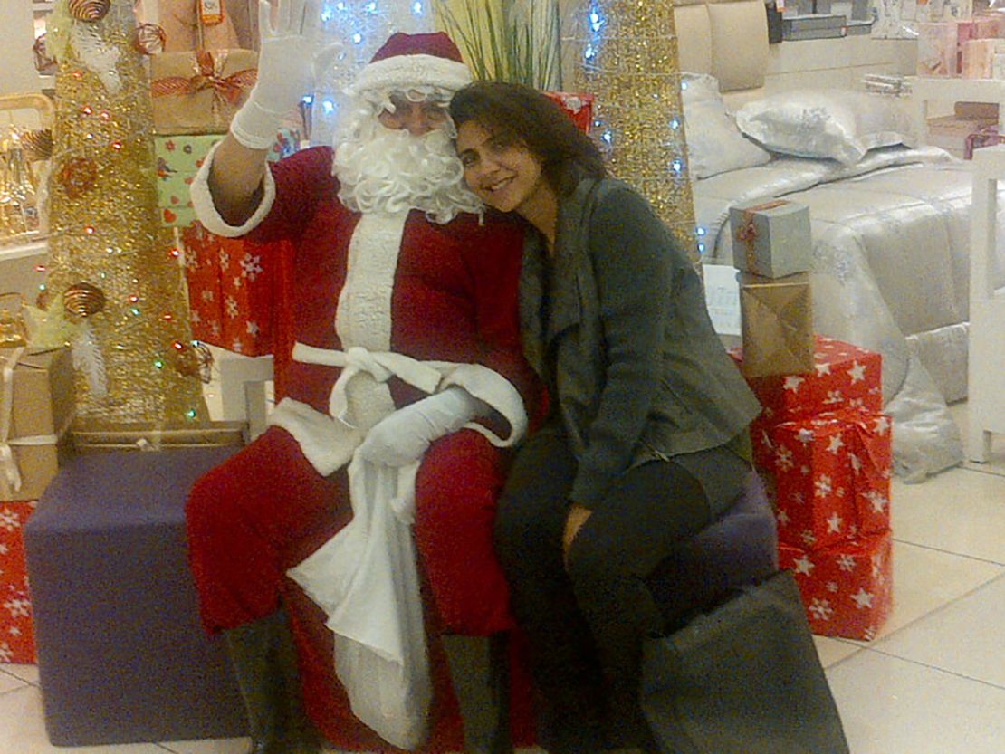 Shafali Jashanmal with her father, Mohan Jashanmal, who is dressed as Santa Claus to entertain the children who visit their store in a mall in Abu Dhabi.