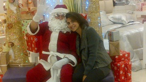 Shafali Jashanmal with her father, Mohan Jashanmal, who is dressed as Santa Claus to entertain the children who visit their store in a mall in Abu Dhabi.