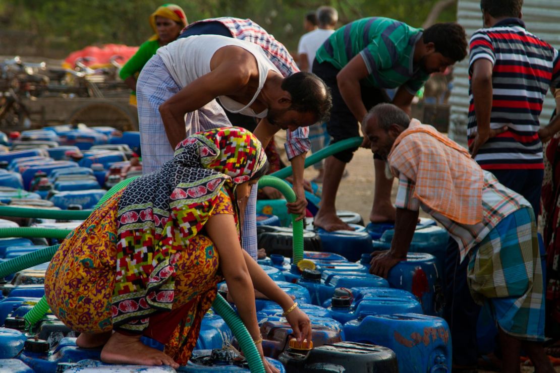 The tanker water often runs out before all the containers are full.