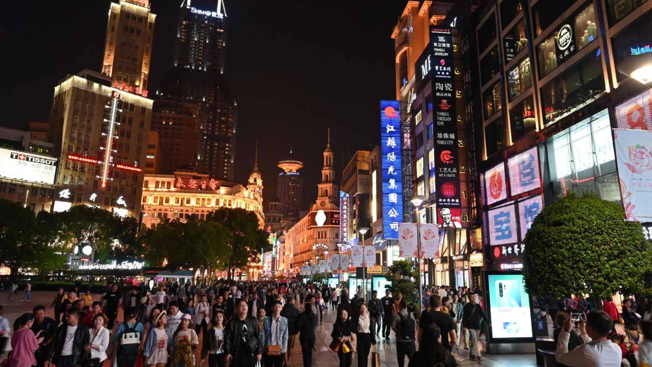 People walking through a shopping area in Shanghai. China's retail sales growth cooled significantly last month, according to figures released Wednesday.