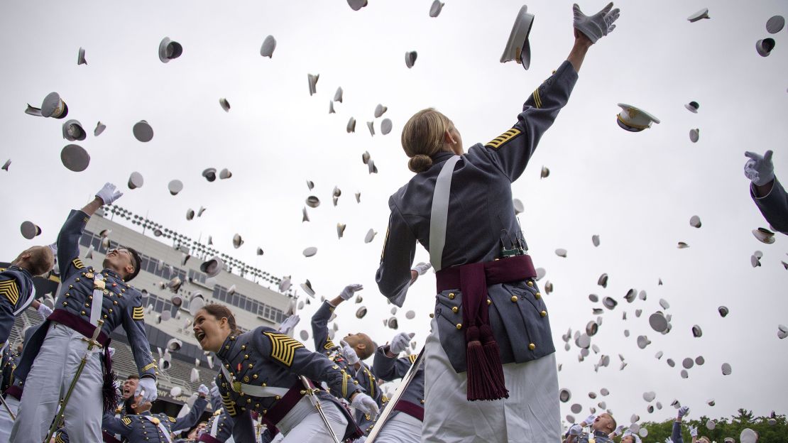 The 2014 graduating class at the United States Military Academy at West Point, New York, throw their covers in the air at the end of the ceremony May 28, 2014. 