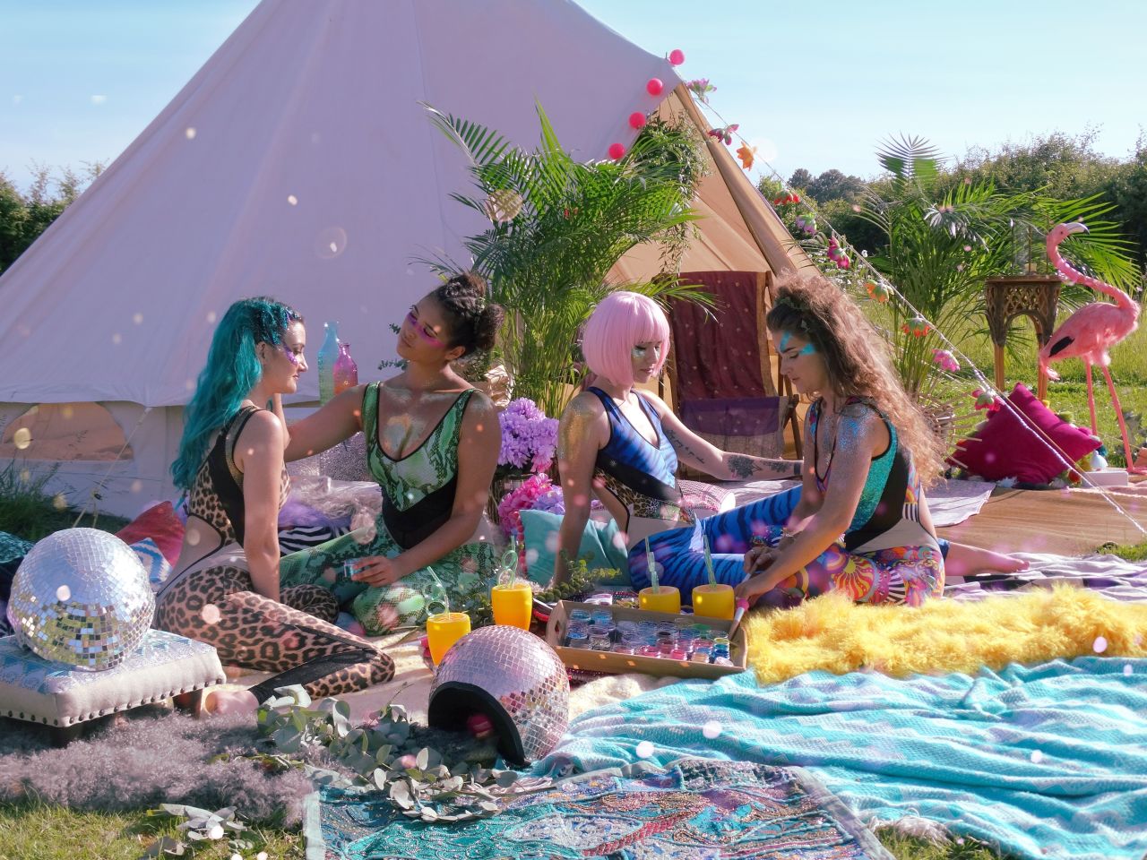 Festivalgoers are pictured wearing Bioglitter.