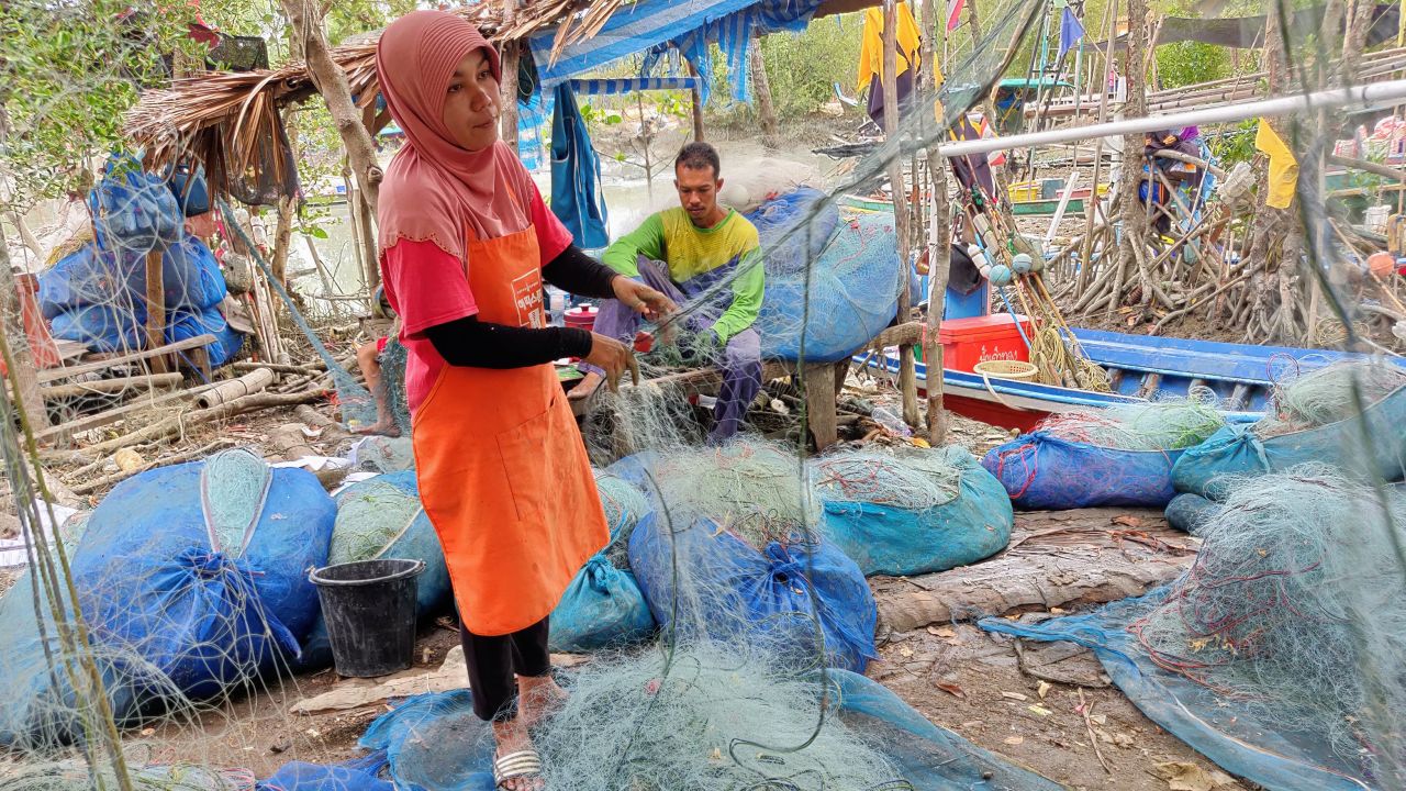 Untangling fishing nets.