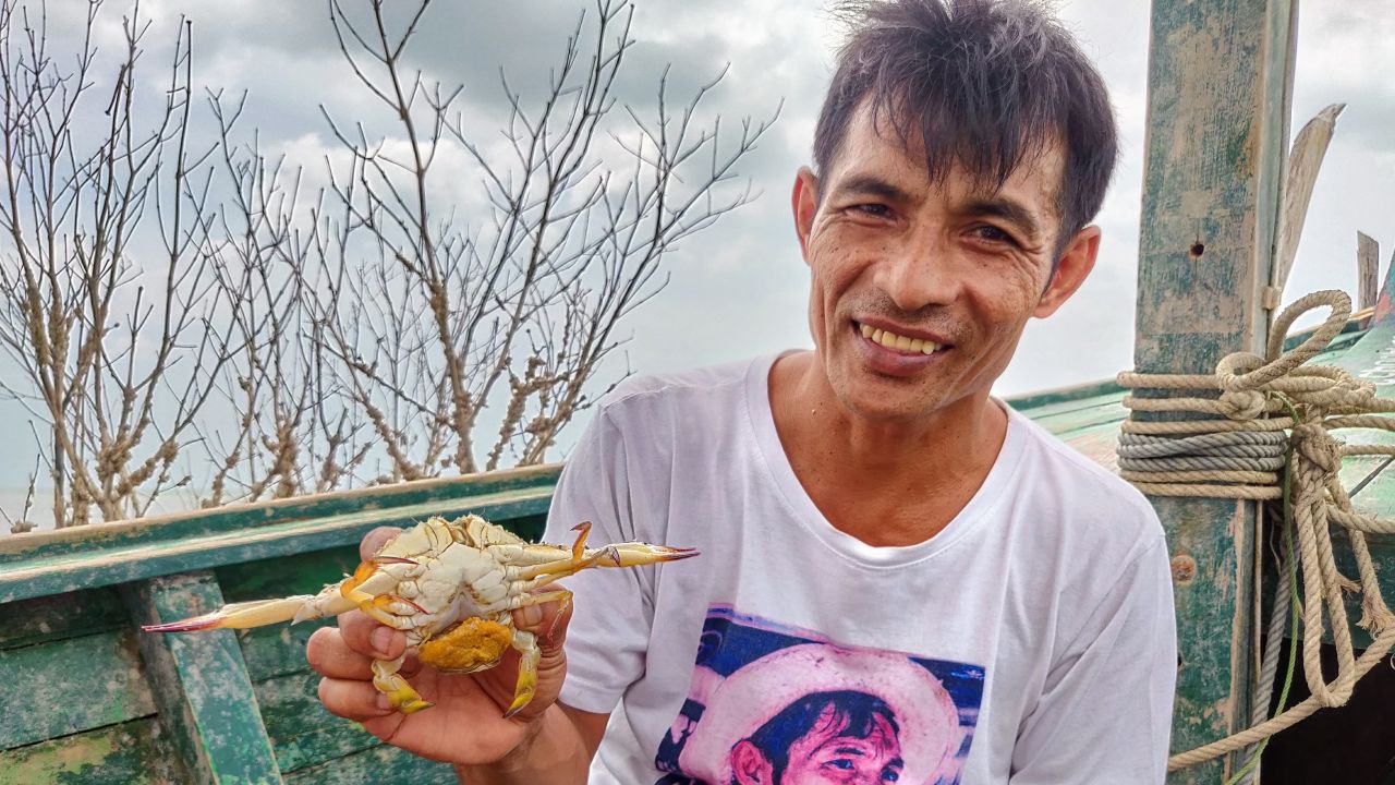 This pregnant crab -- with a cluster of eggs underneath -- is about to be returned to the sea.