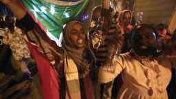 TOPSHOT - Sudanese protestors celebrate after an agreement was reached with the military council to form a three-year transition period for transferring power to a full civilian administration, in Khartoum, early on May 15, 2019. - The protest movement is demanding a civilian-led transition following 30 years of iron-fisted rule by now deposed president Omar al-Bashir, but the generals who toppled him have been holding onto a leadership role. (Photo by ASHRAF SHAZLY / AFP)        (Photo credit should read ASHRAF SHAZLY/AFP/Getty Images)
