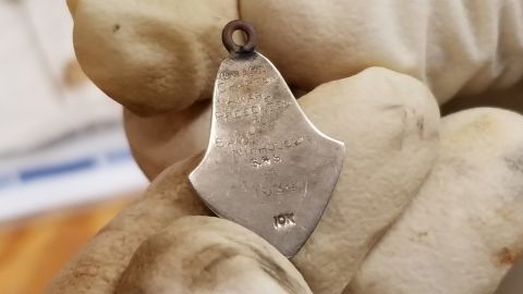 The pin with the engraving of Samuel Nichols Jr