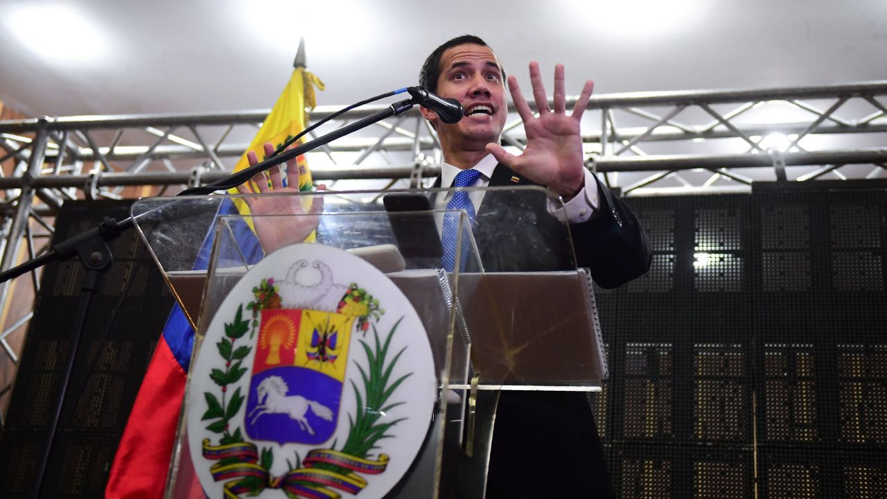 Venezuelan opposition leader and self-declared president Juan Guaido talks at a meeting in Caraca's Chamber of Commerce Auditorium.