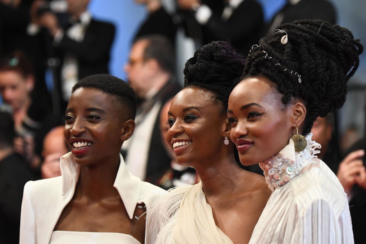 Actress Samantha Mugatsia, director Wanuri Kahiu and actress Sheila Munyiva pose as they arrive on May 9, 2018 for the screening of the film "Rafiki" at the 71st edition of the Cannes Film Festival.