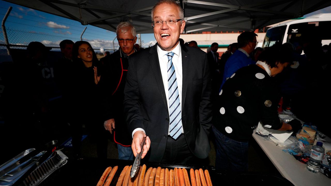 Scott Morrison, Prime Minister of Australia, cooks sausages during a Liberal Party Campaign Rally at Launceston Airport on April 18, 2019