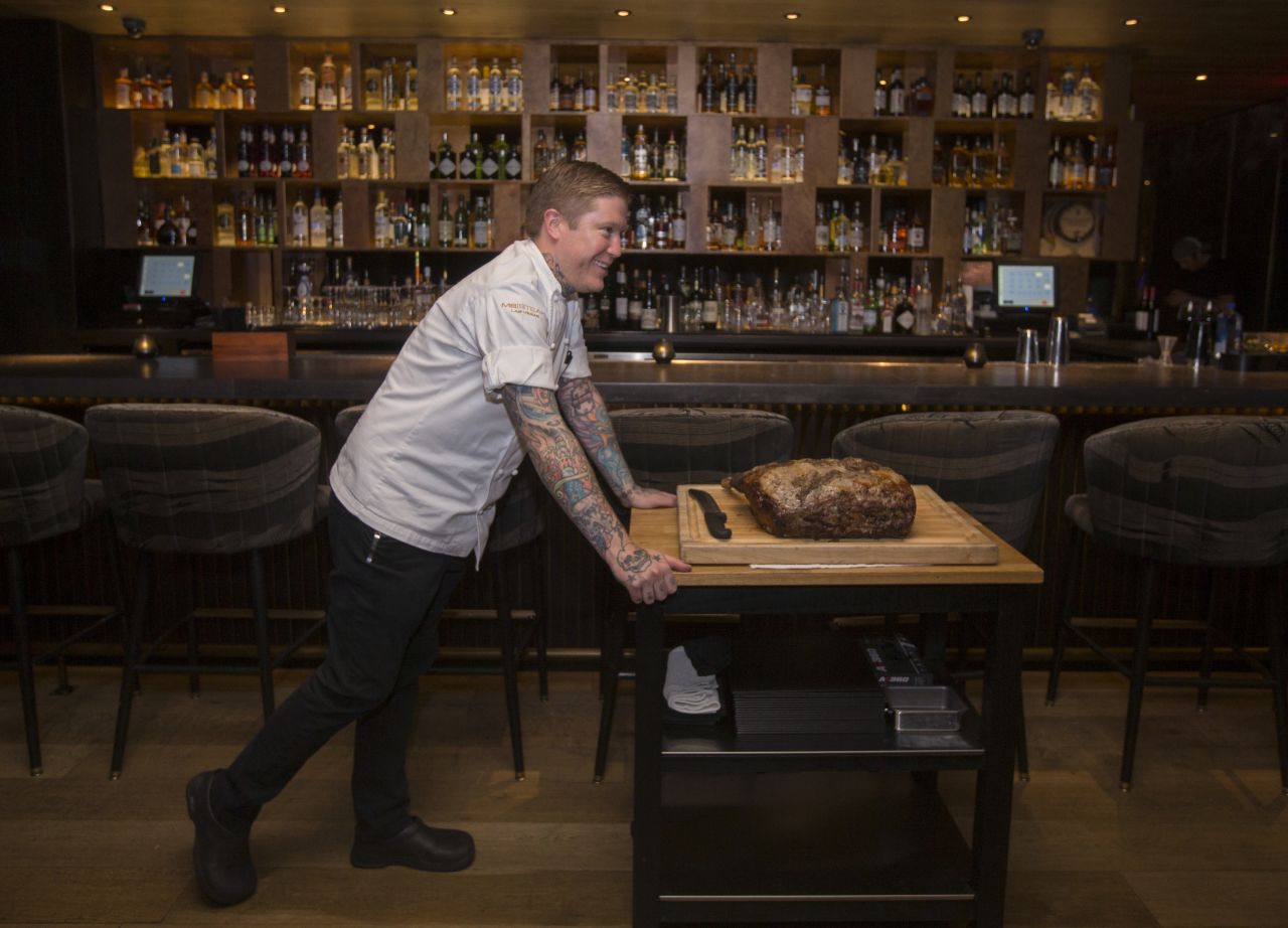 Chef Patrick Munster presents the meat to the table before carving tableside.