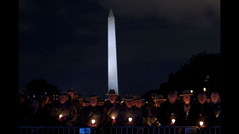 Law enforcement personnel attend a candlelight vigil on the National Mall in Washington on Monday, May 13. The annual vigil commemorates new names that have been added to the National Law Enforcement Officers Memorial. Nineteen weeks into 2019, 18 officers across the country <a href="https://www.cnn.com/2019/02/07/us/2019-officers-killed-trnd/index.html" target="_blank">had been shot and killed in the line of duty.</a>