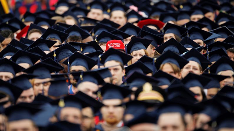 A graduate wears a "Make America Great Again" hat at commencement ceremonies held Saturday, May 11, at Liberty University in Lynchburg, Virginia.