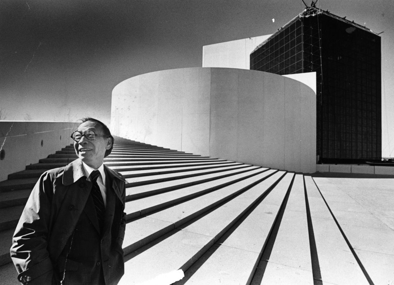 Pei stands outside the John F. Kennedy Presidential Library and Museum in Boston on October 16, 1979. Pei was chosen to design the building in 1964. This was the first time he had seen the building in person since designing it.