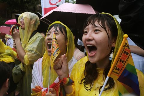 Same-sex marriage supporters shout during a parliament vote on three draft bills of a same-sex marriage law, outside the Legislative Yuan in Taipei, on Friday.
