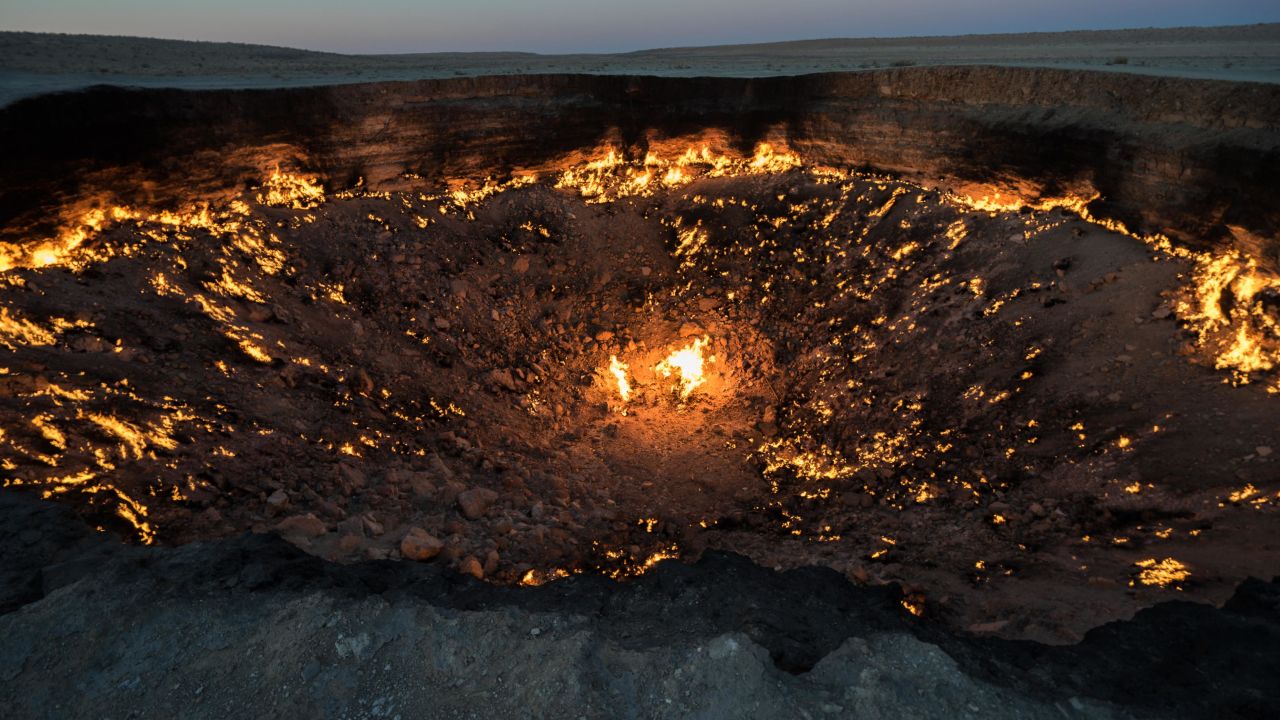 The Darvaza Gas Crater sits in the middle of the Karakum Desert.