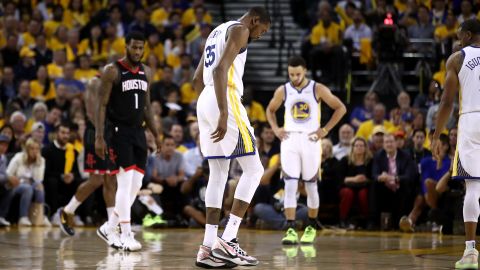 Durant walks off the court after straining his right calf in the game against the Houston Rockets.