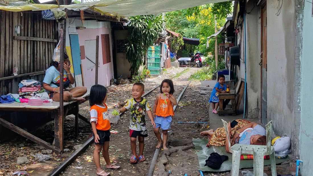 Local Alike guide Chan Kaithong gives tours of the Khlong Toei district. Trains used to pass through the middle of the slum but since the route was decommissioned in 2017, it has been safe for children to play on the tracks. 