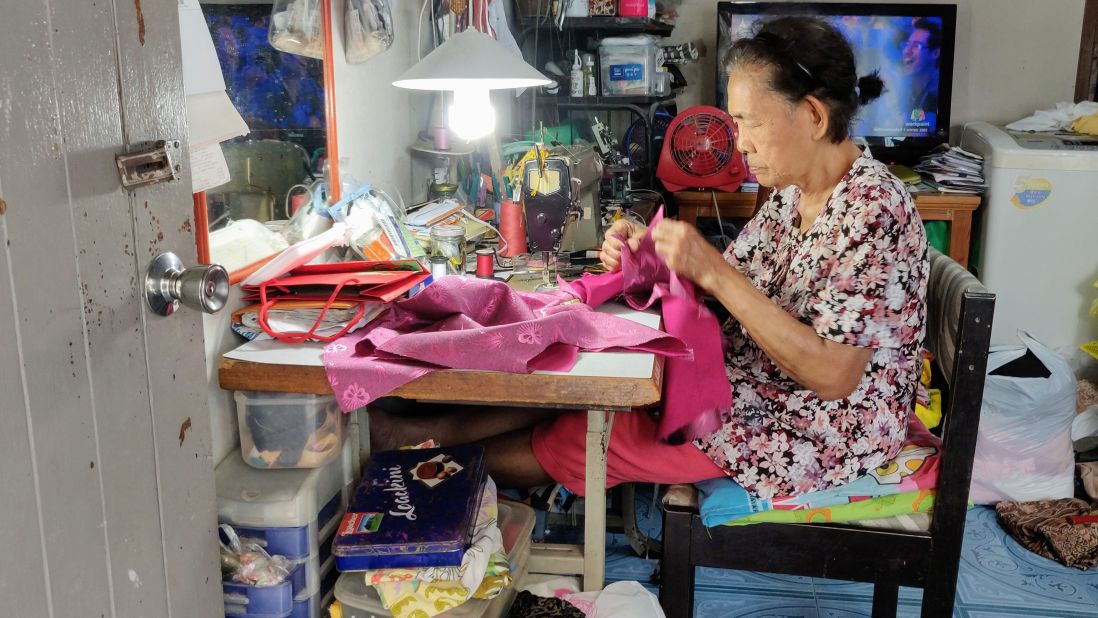 This tailor is still sewing for a living, aged 80.