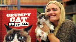 Grumpy Cat and owner Tabatha Bundesen attend the premiere of her latest book "No-It-All: Everything You Need To No" at Strand Bookstore on October 9, 2015 in New York City.