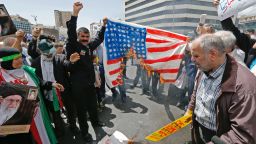 Iranian demonstrators burn a makeshift US flag during a rally in the capital Tehran, on May 10 2019.  (Photo by STR / AFP)        (Photo credit should read STR/AFP/Getty Images)