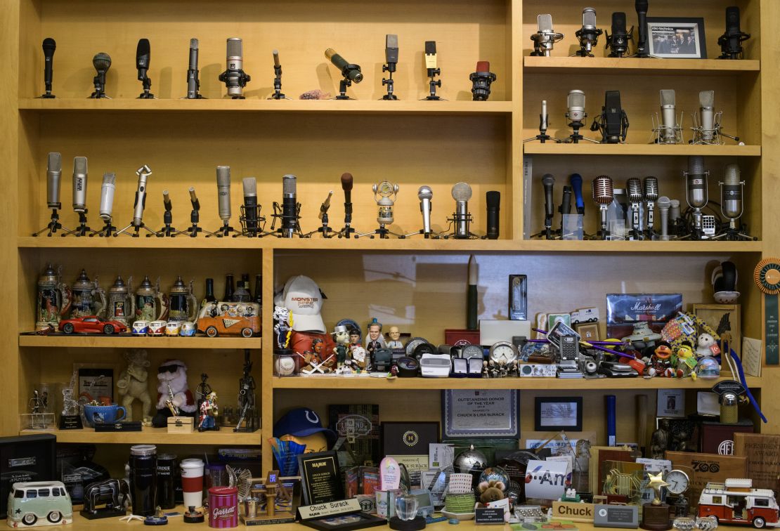 Microphones and collectibles line the shelves of Chuck Surack's office at Sweetwater Sound's 400,000 square-foot campus.