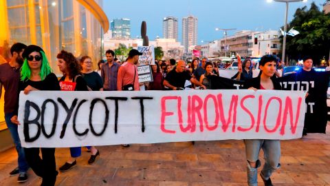 Israelis hold slogans during a protest against Eurovision on May 14 in Tel Aviv.