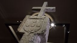 A picture taken on May 17, 2019 in Berlin shows a Stone Cross, a key 15th-century navigation landmark erected by Portuguese explorers, seen at the History Museum in Berlin. - The History Museum museum announced it would restitute the cross to Namibia as part of Berlin's efforts to face up to its colonial past. Placed in 1486 on the western coast of what is today Namibia, the Stone Cross was once considered to be such an important navigation marker that it featured on old world maps. In the 1890s, it was removed from its spot on Cape Cross and brought to Europe by the region's then German colonial masters. (Photo by Tobias SCHWARZ / AFP)        (Photo credit should read TOBIAS SCHWARZ/AFP/Getty Images)