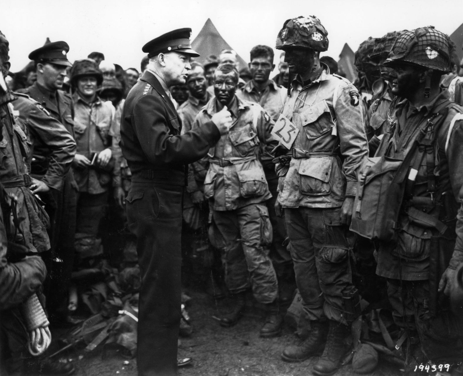 Eisenhower, supreme commander of the Allied forces, gives the order of the day to paratroopers in England. "Full victory — nothing else" was the command just before they boarded their planes to participate in the first wave.