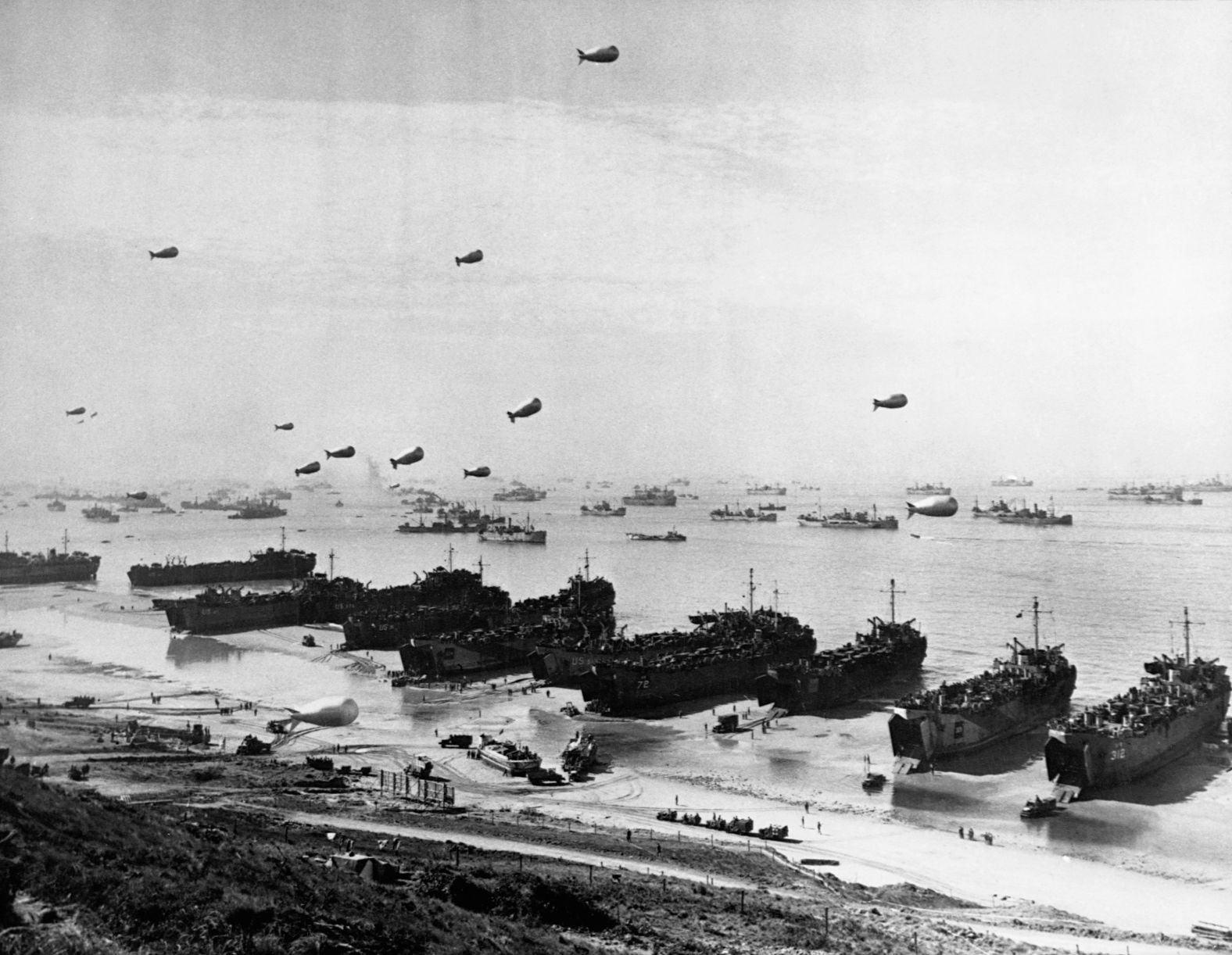 Landing craft and a fleet of protection vessels approach Omaha Beach. By midnight, the troops had secured their beachheads and moved further inland.