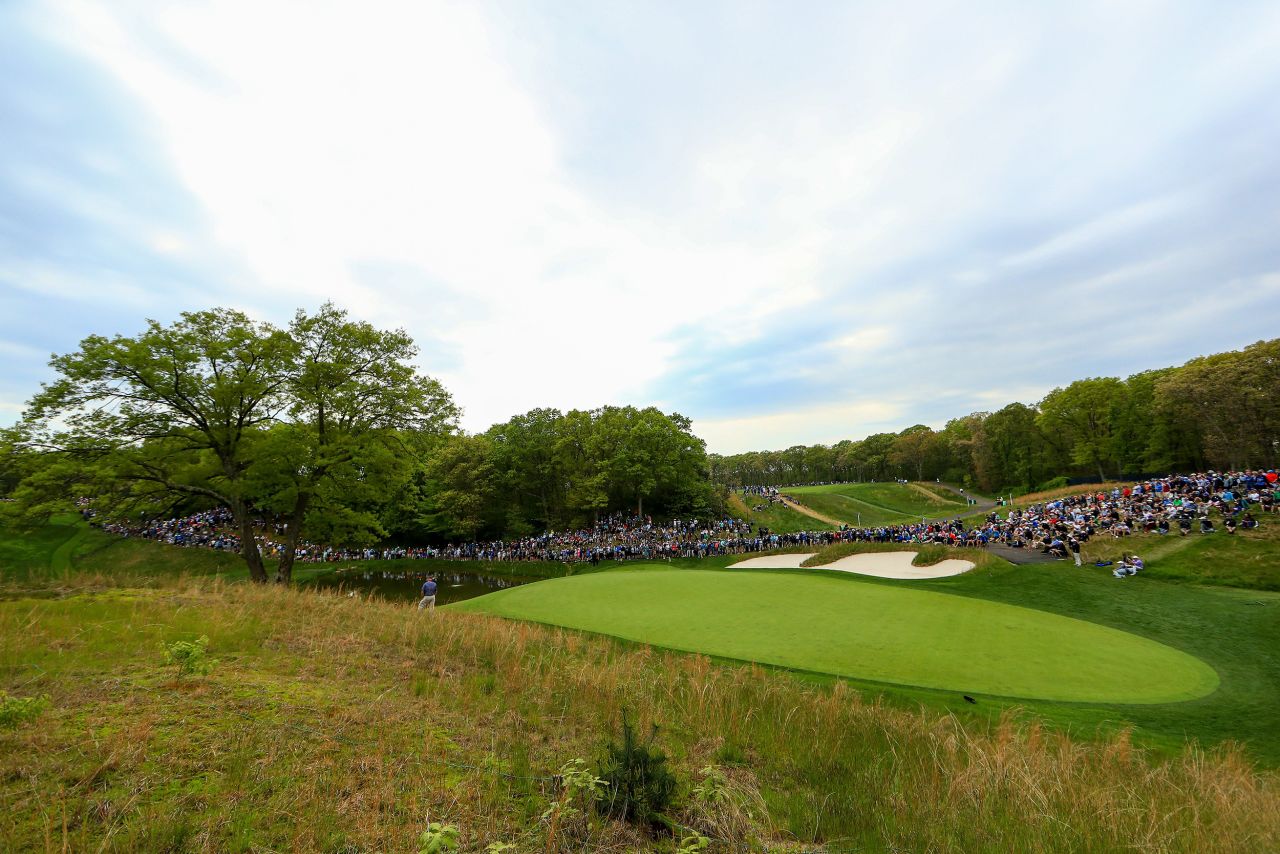 Fans line up near the the eighth green during the second round.
