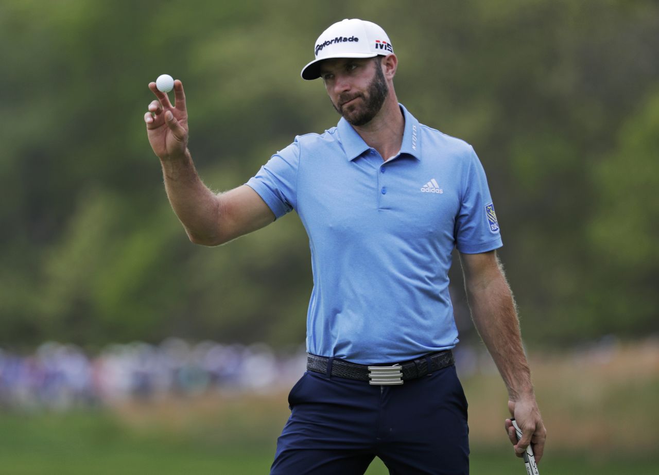 World No.1 Dustin Johnson reacts after putting on the seventh green.