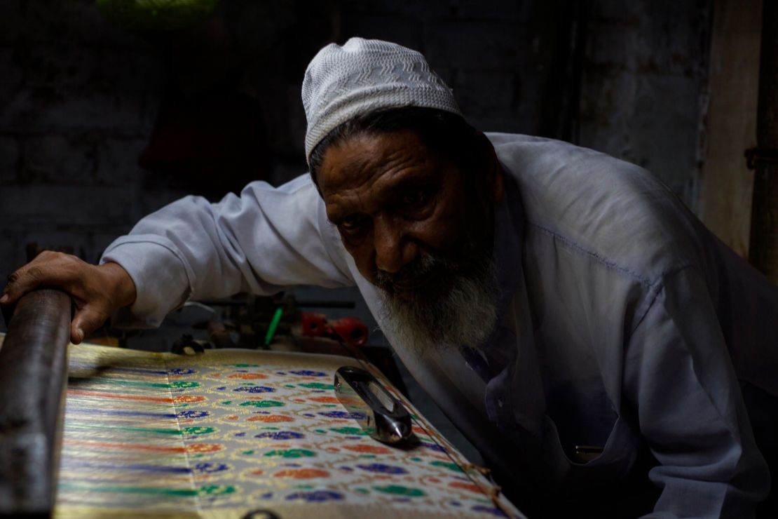 Hanif Babu and some of the intricate silk finery he and his family make.