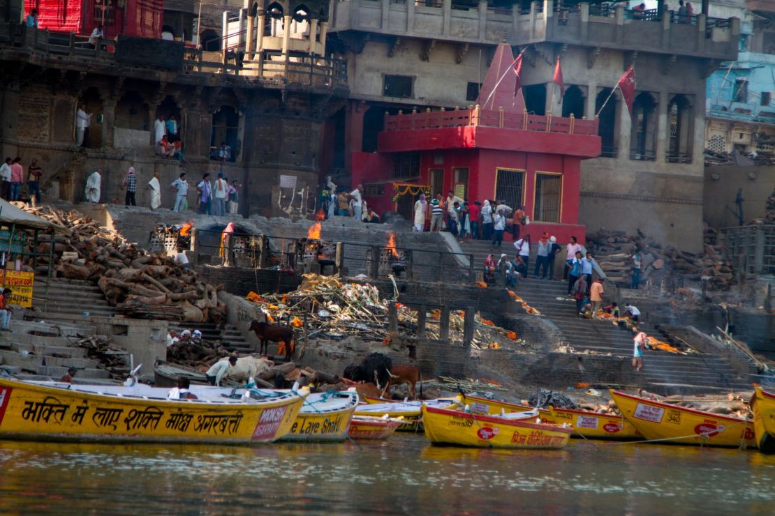Manikarnika Ghat, one of the most sacred places in Varanasi, is where the faithful come to cremate their dead on funeral pyres, which burn 24 hours a day.