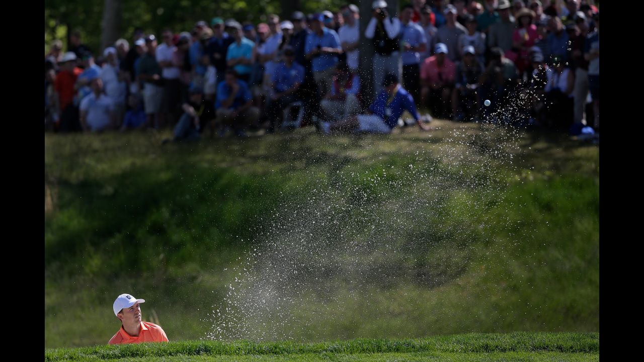 Jordan Spieth hits out of a bunker onto the fifth green during the third round of the PGA Championship golf tournament on Saturday, May 18.