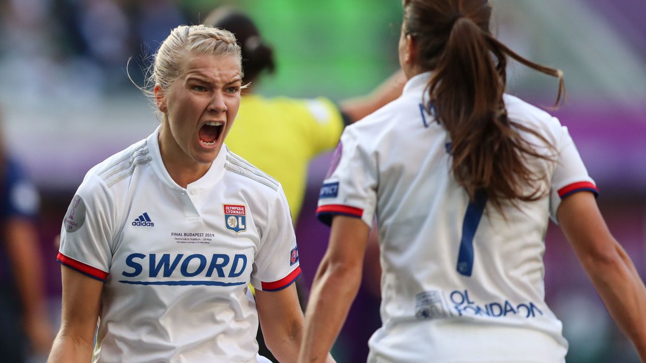 Ada Hegerberg celebrates with teammate Amel Majri.