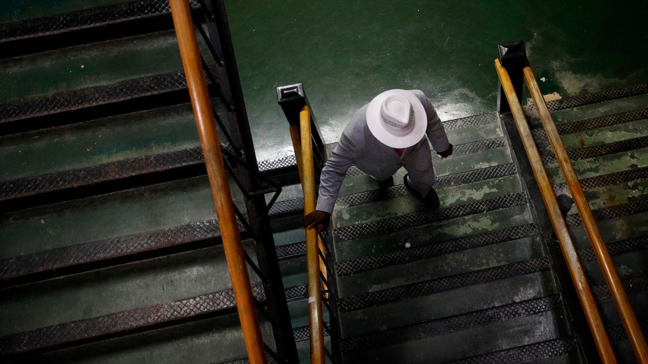 A spectator takes a staircase at Pimlico Race Course ahead of the Preakness Stakes horse race in Baltimore on Saturday.