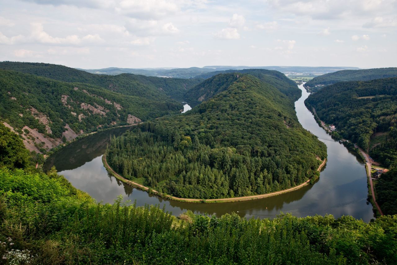 <strong>Saar Loop at Mettlach: </strong>The Saar River makes a deep turn as it approaches the German town of Mettlach, curving into a horseshoe shape known as the Saar Loop. The best way to take in this natural curiosity is by trekking up the free Saarschleife outlook for a panoramic view. 