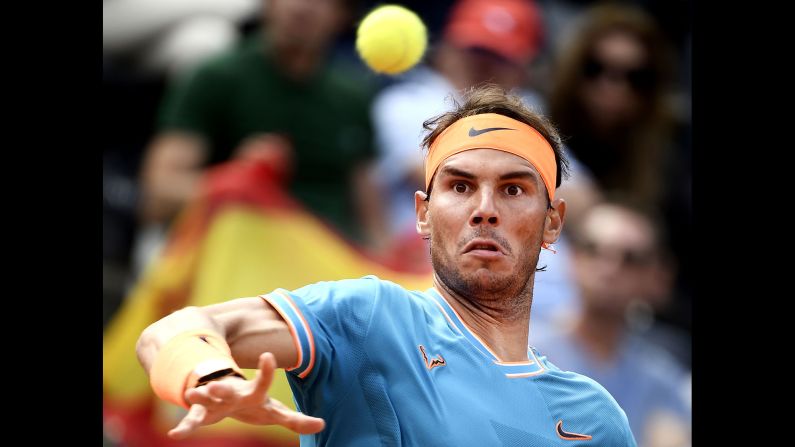 Rafael Nadal returns a ball against Novak Djokovic during their ATP Masters final match at the Foro Italico in Rome on Sunday, May 19. Nadal defeated Djokovic in three sets.