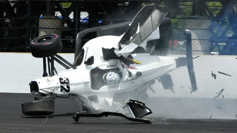 Kyle Kaiser crashes his car and goes airborne after hitting the wall along the third turn during practice for the Indianapolis 500 IndyCar auto race at Indianapolis Motor Speedway on Friday, May 17.