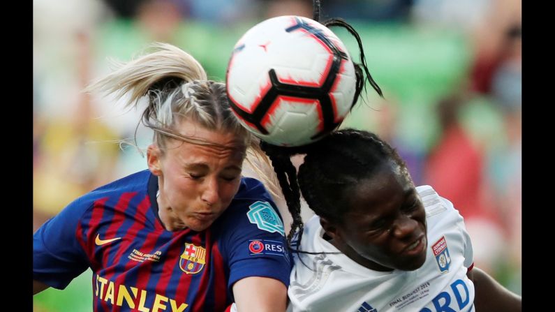 Barcelona's Toni Duggan competes for a ball with Olympique Lyonnais' Griedge Mbock during the Women's Champions League final on Saturday, May 18 in Budapest, Hungary.