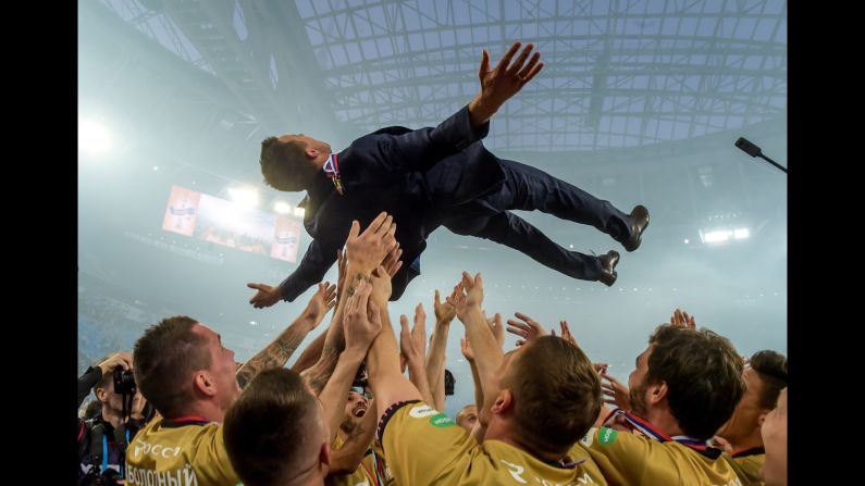 Zenit St. Petersburg players toss head coach Sergei Semak in the air after defeating CSKA Moscow for the Russian Premier League on Sunday, May 12, in St. Petersburg, Russia. The newly-crowned champions battled back from a goal down to beat CSKA Moscow 3-1.