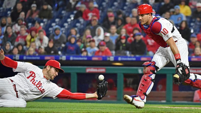 Philadelphia Phillies starting pitcher Jerad Eickhoff dives for a ball hit by Milwaukee Brewers relief pitcher Brandon Woodruff during the fourth inning of a baseball game at Citizens Bank Park on Tuesday, May 14 in Philadelphia. Eickhoff was unable to catch the ball and Woodruff reached first base on the play.
