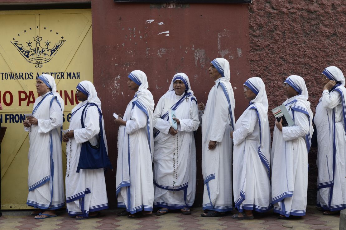 Nuns wait in queue to cast their vote at a polling station during the last phase of Lok Sabha Election or general election on May 19, 2019.