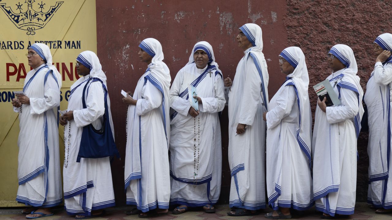 Nuns wait in queue to cast their vote at a polling station during the last phase of Lok Sabha Election or general election on May 19, 2019.