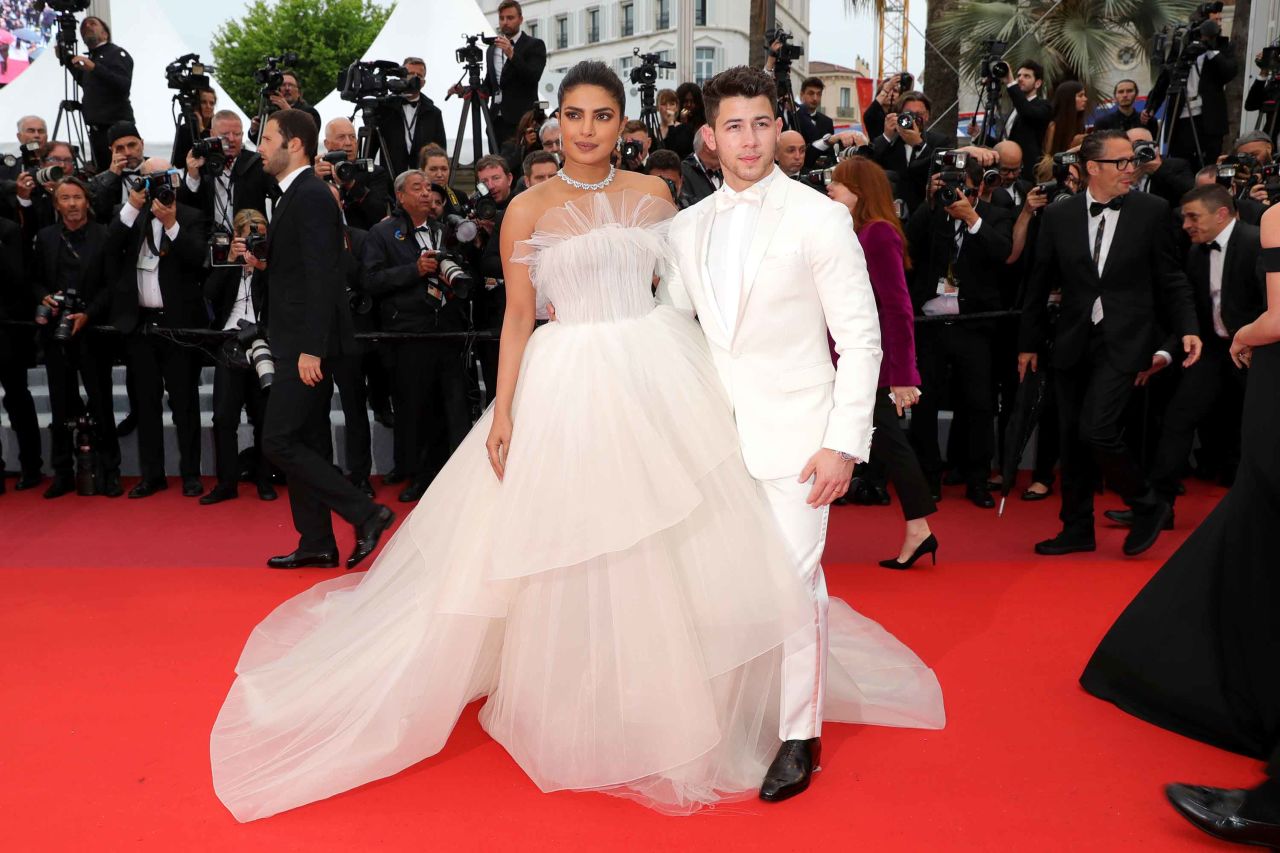 Newlyweds Priyanka Chopra (wearing a strapless Georges Hobeika gown) and Nick Jonas attend the screening of "Les Plus Belles Annees D'Une Vie."