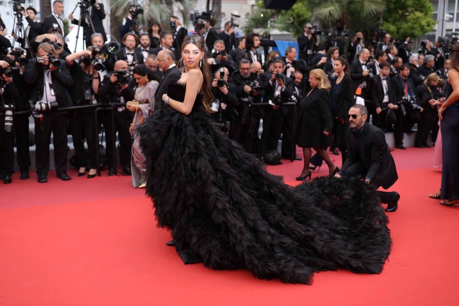 Singer Madison Beer gets a hand with her Georges Hobeika gown.