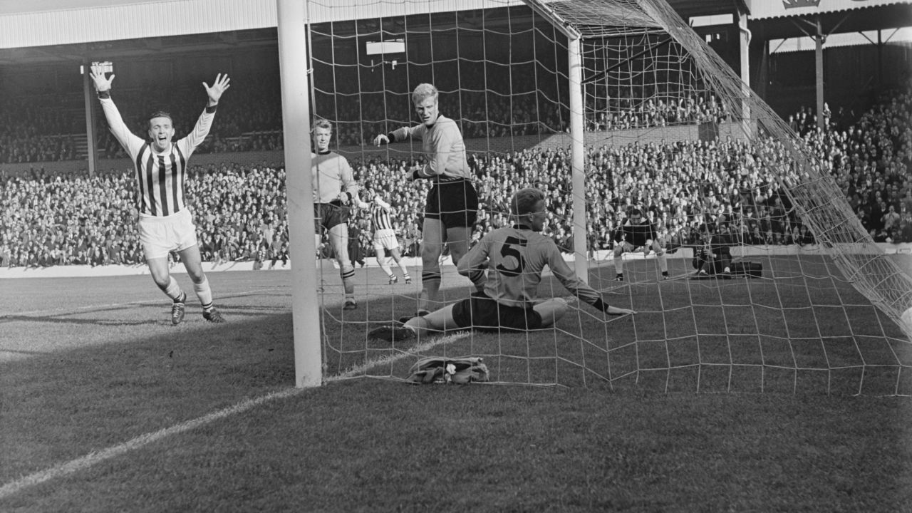 WBA's Jeff Astle of West scores against Wolves in October 1964.
