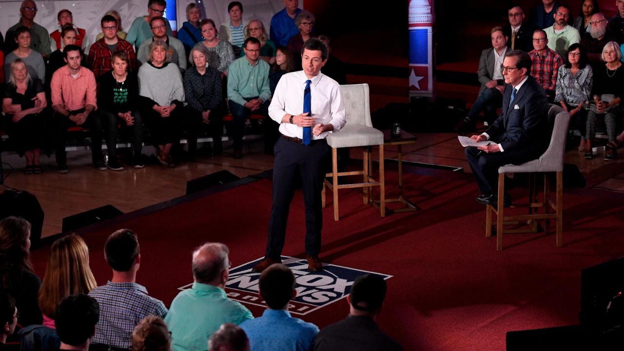 Democratic presidential candidate Pete Buttigieg, center, answers a question during a FOX News Channel town hall moderated by Chris Wallace.