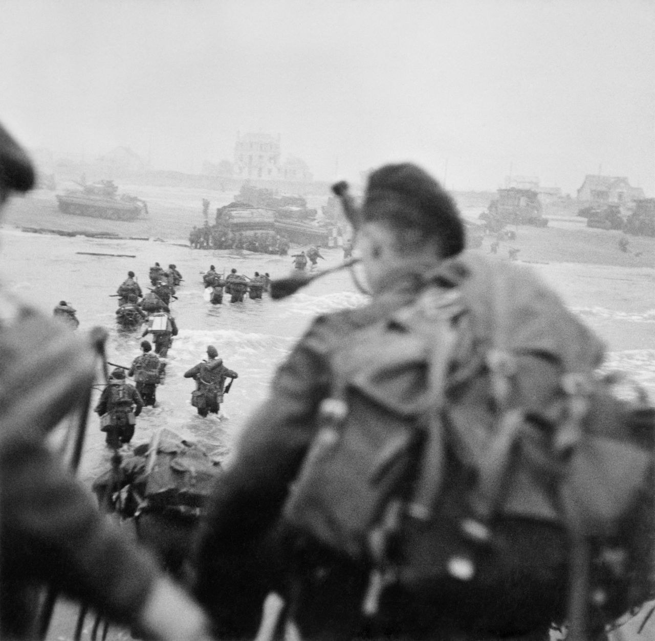 Commandos of 1st Special Service Brigade land on 'Queen Red' Beach, Sword sector, at around 8.40am on 6 June 1944. 